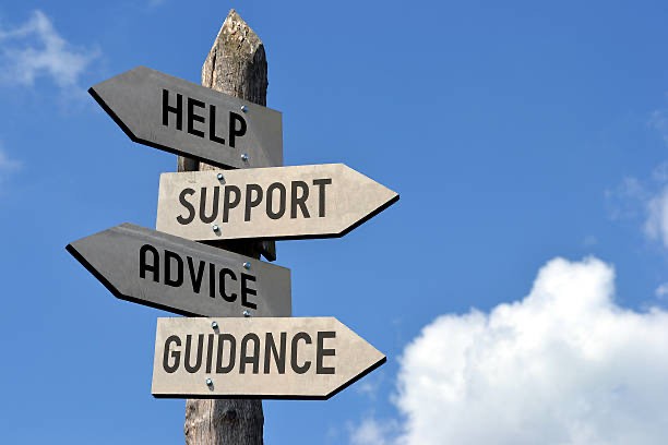 A set of signposts towards 'Help', 'Support', 'Advice' and 'Guidance'